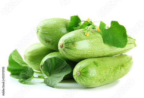 Photo: Raw zucchini with leaves, isolated on white Raw zucchini with leaves, isolated on white