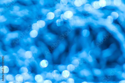 Photo: Circular blue bokeh background. Circular blue bokeh background.