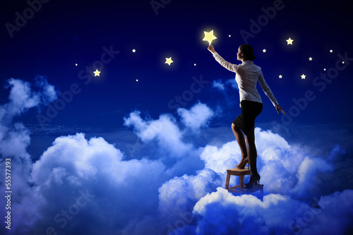 Photo: Woman lighting stars Woman lighting stars