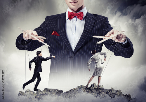 Photo: Businessman puppeteer Businessman puppeteer