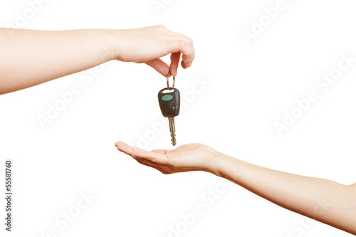 Photo: Hand offering car keys Hand offering car keys
