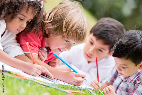 Photo: Group of kids coloring Group of kids coloring
