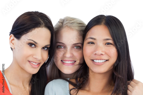 Photo: Diverse young women smiling at camera Diverse young women smiling at camera