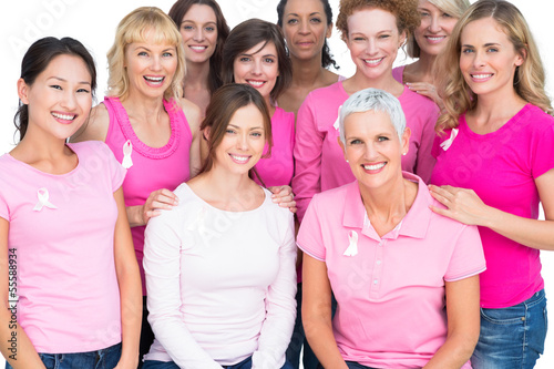 Photo: Voluntary pretty women posing and wearing pink for breast cancer Voluntary pretty women posing and wearing pink for breast cancer