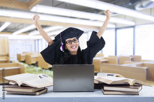 Photo: Happy graduate laughing in class Happy graduate laughing in class