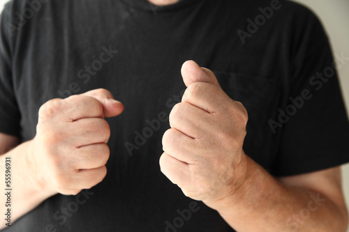 Photo: older man making fists older man making fists
