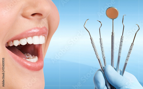 Photo: Teeth with dental tools. Teeth with dental tools.