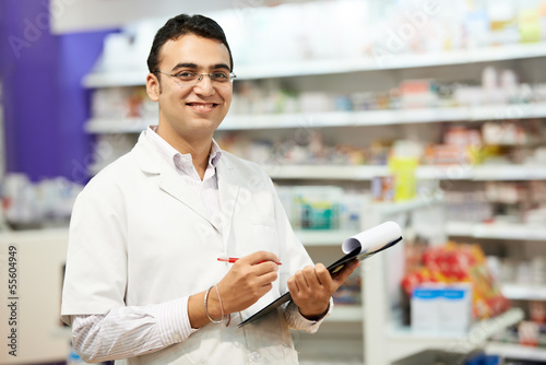 Photo: Pharmacy chemist woman in drugstore Pharmacy chemist woman in drugstore