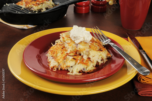 Photo: Latkes topped with sour cream Latkes topped with sour cream