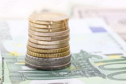Photo: pile of eurocoins on banknotes pile of eurocoins on banknotes