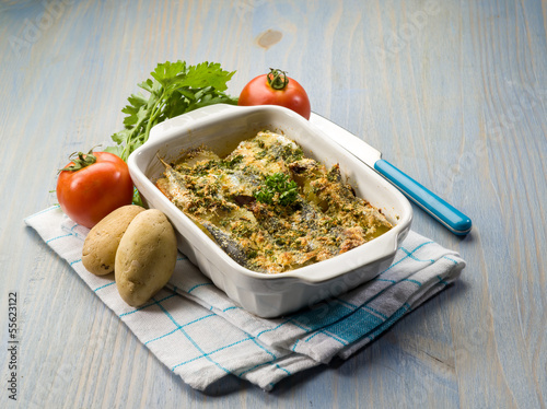 Photo: cake with anchovies tomato and potatoes cake with anchovies tomato and potatoes