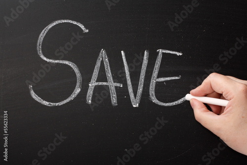 Photo: Writing the word Save on a Blackboard Writing the word Save on a Blackboard