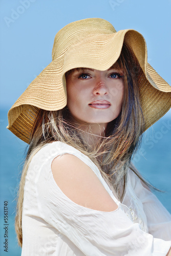 Photo: woman in straw hat woman in straw hat