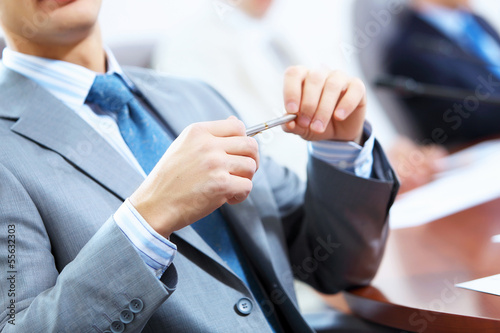 Photo: Three businesspeople at meeting Three businesspeople at meeting