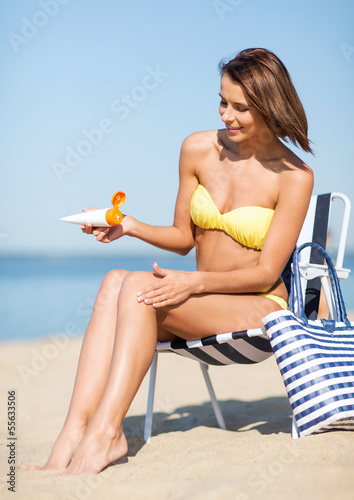 Photo: girl sunbathing on the beach chair girl sunbathing on the beach chair