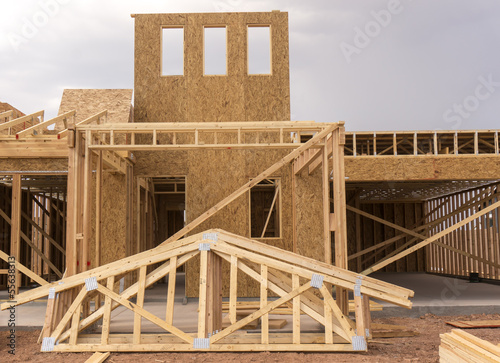 Photo: New home under construction wood frame New home under construction wood frame
