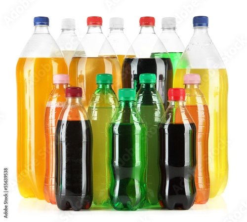 Photo: Assortment of bottles with tasty drinks, isolated on white Assortment of bottles with tasty drinks, isolated on white
