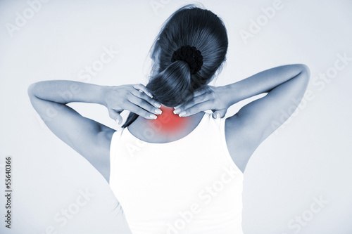 Photo: Young girl and pain in neck in shades of grey Young girl and pain in neck in shades of grey