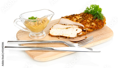 Photo: Roasted chicken fillets on wooden board, isolated on white Roasted chicken fillets on wooden board, isolated on white