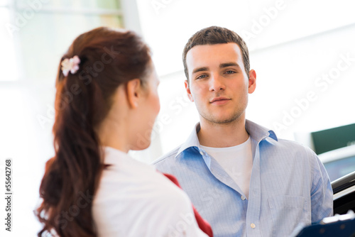 Photo: Consultant in the showroom and the buyer Consultant in the showroom and the buyer