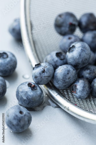Photo: Blueberries in strainer, selective focus Blueberries in strainer, selective focus