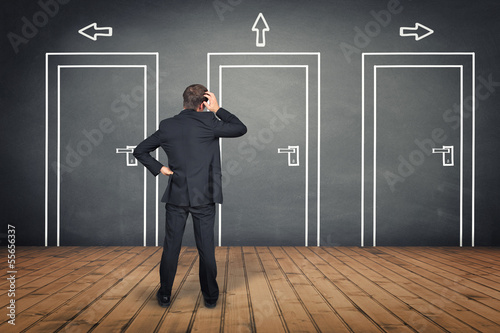 Photo: Businessman thinking about Decision Businessman thinking about Decision