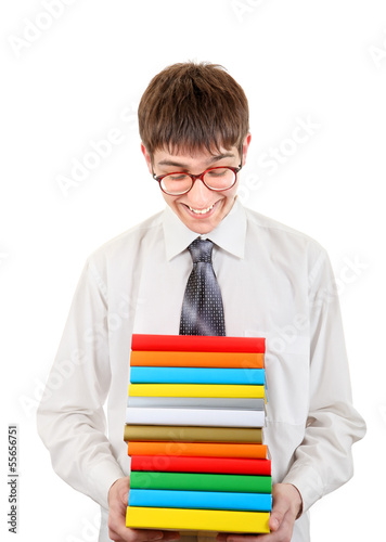 Photo: Happy Student holding Pile of the Books Happy Student holding Pile of the Books