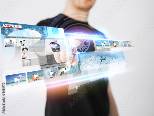 Photo: man pressing button on virtual screen man pressing button on virtual screen
