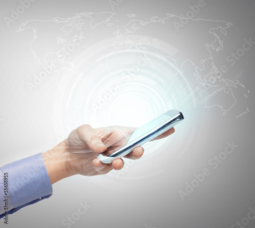 Photo: hand with smartphone and virtual screen hand with smartphone and virtual screen