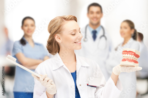 Photo: doctor with big jaws and toothbrush doctor with big jaws and toothbrush