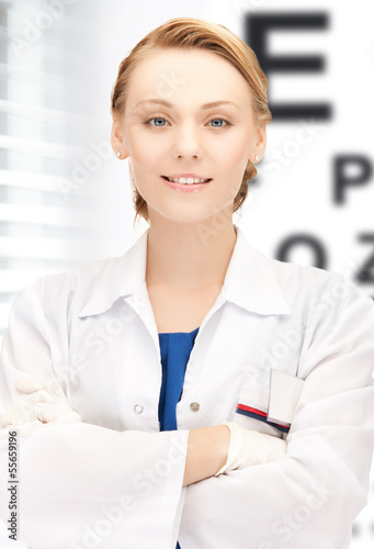 Photo: female ophthalmologist with eye chart female ophthalmologist with eye chart