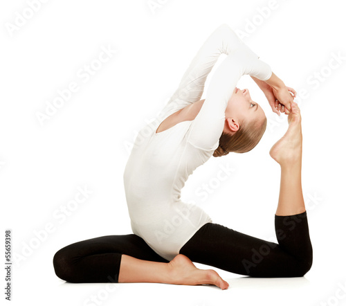 Photo: Gymnast girl in flexible back pose, isolated on white background Gymnast girl in flexible back pose, isolated on white background