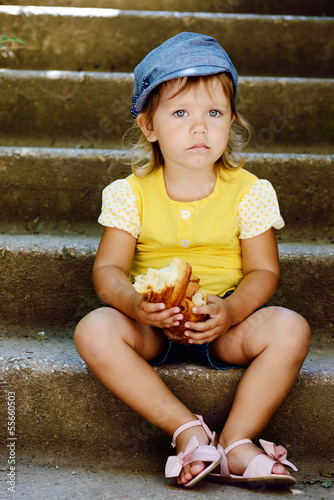 Photo: cute toddler eating outdoors cute toddler eating outdoors