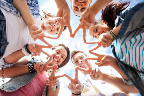 Photo: group of teenagers showing finger five group of teenagers showing finger five