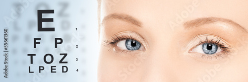 Photo: woman and eye chart woman and eye chart