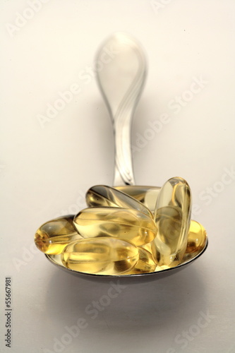 Photo: Fish oil capsules in a spoon Fish oil capsules in a spoon
