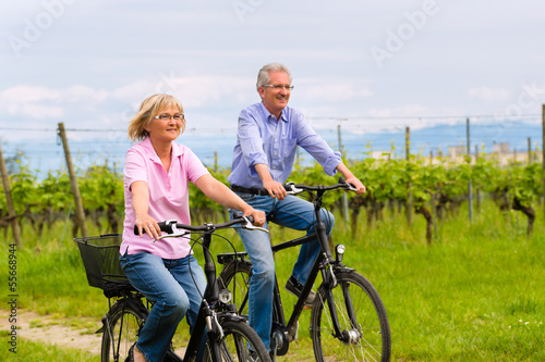 Photo: Seniors exercising with bicycle Seniors exercising with bicycle