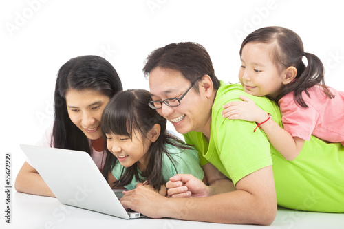 Photo: happy family with computer happy family with computer