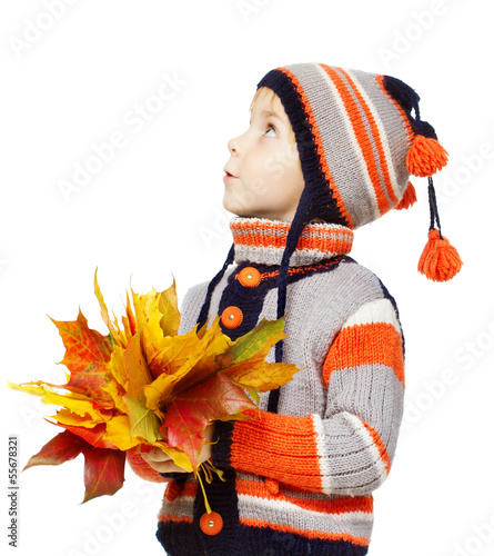 Photo: Child in autumn leaves. Maple fall over white Child in autumn leaves. Maple fall over white