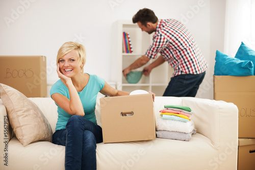Photo: Couple decorating their new living room Couple decorating their new living room