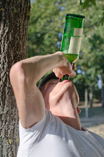 Photo: Alcoholic gulping down alcohol Alcoholic gulping down alcohol