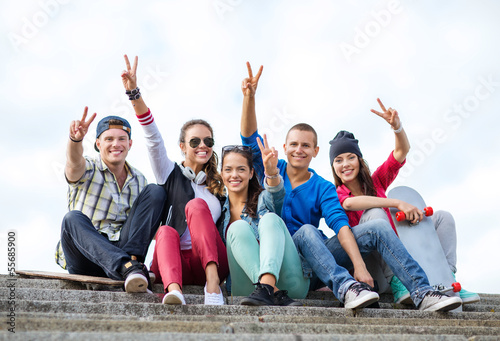 Photo: group of teenagers showing finger five group of teenagers showing finger five
