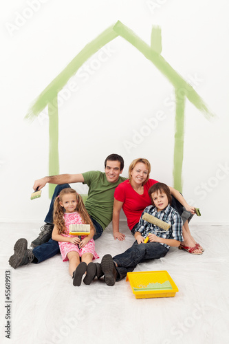 Photo: Happy family with kids redecorating their home Happy family with kids redecorating their home