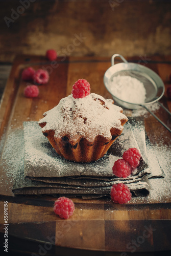 Photo: Fruitcake Decorated with Raspberry, vertical, toned Fruitcake Decorated with Raspberry, vertical, toned
