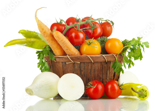 Photo: Fresh vegetables in basket isolated on white Fresh vegetables in basket isolated on white
