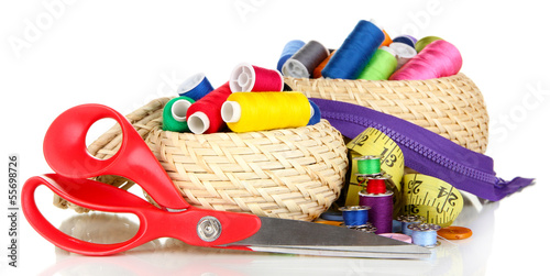 Photo: Wicker baskets with accessories for needlework isolated on Wicker baskets with accessories for needlework isolated on