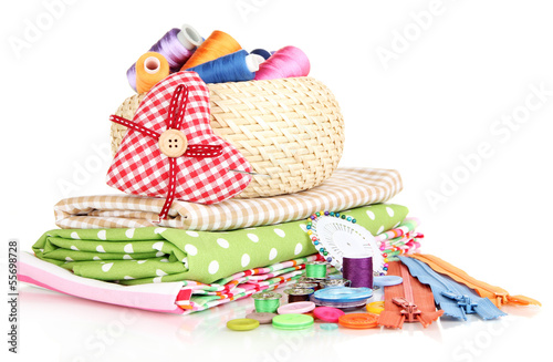Photo: Wicker basket with accessories for needlework isolated on white Wicker basket with accessories for needlework isolated on white