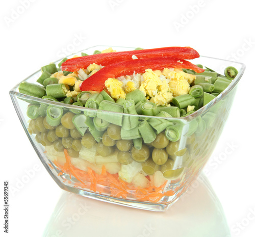 Photo: Tasty salad with fresh vegetables, isolated on white Tasty salad with fresh vegetables, isolated on white