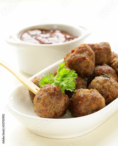 Photo: meatballs - traditional meat dish with sauce and herbs meatballs - traditional meat dish with sauce and herbs