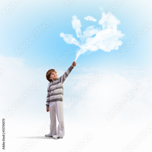Photo: Cute boy catching clouds Cute boy catching clouds
